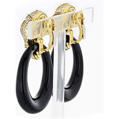 Experience the allure of timeless elegance with the Marina B. Diamond 18K Yellow Gold Black Onyx Door-Knocker Earrings. These exquisite ear pendants, affectionately known as 'Ken,' capture the essence of classic door knockers with a contemporary twist. Crafted with meticulous attention to detail, these earrings are mounted on 18kt yellow gold, creating a luxurious and radiant backdrop.The tops of these earrings are adorned with dazzling round cut diamonds, delicately set between the mesmerizing Radiant Ring, Classic Doors, Diamond Birthstone, Door Knocker, Gold Top, Tennis Necklace, Door Knockers, Diamond Design, Round Cut Diamond