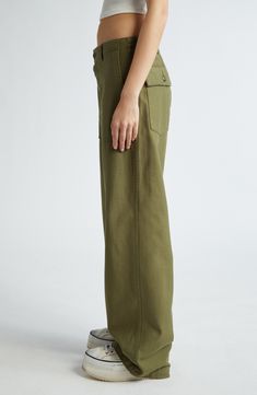 These utility pants are cut in a wide-leg silhouette from Japanese surplus military sateen that's slubbed and treated with an enzyme wash for softness. 32 1/2" inseam; 22" leg opening; 13 1/2" front rise; 17" back rise (size 29) Button fly Front slant pockets; back button-flap patch pockets 100% cotton Machine wash, dry flat Imported SPACE: A shop for emerging and advanced designers Spring Military Wide Leg Cargo Pants, Spring Military Style Wide Leg Cargo Pants, Spring Military Wide-leg Cargo Pants, Utility Wide Leg Pants With Welt Pockets, Military Style Wide Leg Relaxed Bottoms, Military Style Wide Leg Bottoms With Relaxed Fit, Olive Wide Leg Cargo Pants For Work, Green Utility Wide Leg Pants, Green Wide Leg Cargo Jeans For Workwear