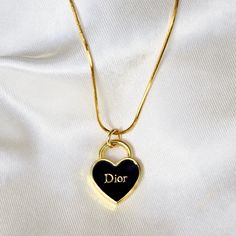 Authentic Dior pendant in gold tone and black enamel set on a 24k gold filled necklace. Product details: limited availability necklace length: 17.8 inches necklace material: 24k gold filled pendant measurements: 16mm pendant is double sided Dior Pendant, Dior Gold, Money Rich, Pendant Necklace Vintage, Gold Heart Pendant, Detailed Necklace, Vintage Chain, Gold Filled Necklace, Heart Pendant Gold