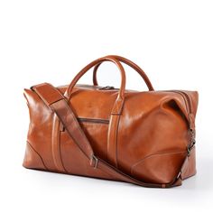 Impeccably crafted from high quality leather, the Graham Leather Collection is filled with classic styles for work and travel. Designed with a place for everything you need for a weekend away, this overnighter features both carrying handles and an adjustable shoulder strap. Add the matching hanging toiletry case for added function and fashion. A great gift for the stylish traveler, you can a classic monogram for an extra elevated touch.    Includes Graham Leather Overnighter and Graham Leather H Leather Overnight Bag, Travel Gift Set, A Place For Everything, Classic Monogram, Work And Travel, Mark And Graham, Rustic Brown, Brown Bags, Leather Travel