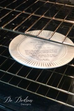 a white plate sitting on top of an oven rack