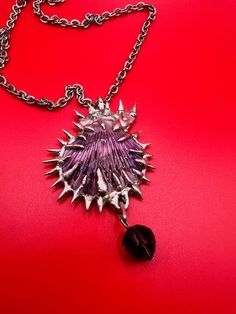 Every piece is completely unique and one of a kind. seashell imperfections are unique to the shell with metal spikes with natural ridges and pattern variations Thrift Flips, Metal Spikes, Necklace Purple, Seashell Jewelry, Purple Necklace, Seashell Necklace, Baltimore Md, Shell Jewelry, Glass Pendant