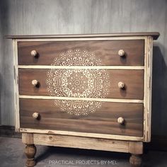 a wooden dresser with ornate carvings on the drawers