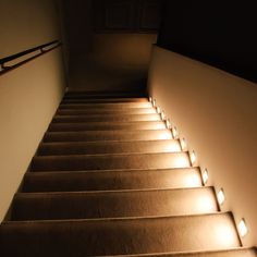 stairs lit up with lights in the dark