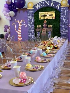 a table set up with plates, cups and saucers for an easter themed party