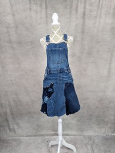 a dress made out of old jeans on a mannequin