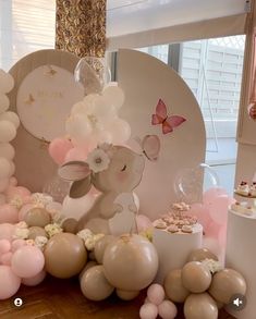 a table topped with balloons and other decorations