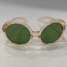 1960's Italian Green Lens Sunglasses Translucent Acetate Oval Frame In Clear Light Pinkish Orangy Color. Unique And Fun! Olive Green Lens Marked 1960's Made In Italy. Perfect Vintage Not Damaged Condition. Tight Temples. It More Fits Smaller Head. See All The Pictures With Measurements. No Scratches. Its Barely Used Vintage Oval Sunglasses For Summer, 60s Sunglasses Vintage, Vintage Green Sunglasses With Polarized Lenses, Vintage Oval Sunglasses With Uv Protection, Vintage Green Tinted Sunglasses, Green Lens, Vintage Italy, Eye Wear, Retro Sunglasses