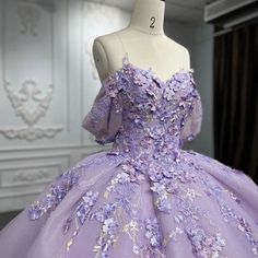 Welcome to Couture Candy's exclusive collection of purple Quinceañera gowns for the 2024 season. Our selection of dresses is expertly made to make every young woman feel exceptional on her milestone day. Our selection includes everything, whether you're searching for something traditional with intricate needlework or something more contemporary with streamlined, clean lines. Blue Pink And Purple Quince Dress, Purple 16 Dresses, Purple Quinceanera Dresses With Flowers, Qinsenara Dresses Purple, Elegant Purple Dress Classy, Purple Blue Quinceanera Dresses, Qencenera Dresses Purple, Debut Gowns 18th Elegant Purple, Quncie Dresses Lavender