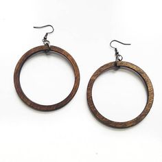 Classic Wooden Hoop Earrings  These simple wooden earrings are a classic hoop shape that never go out of style. They are made out of stained birch wood and work with nearly every outfit.  Very light weight and easy to wear. Laser cut jewelry with a minimal earring design.  There are four Brown Hoop Jewelry With Ear Wire, Brown Hoop Earrings For Gift, Brown Hoop Earrings With Ear Wire, Brown Hoop Single Earring, Brown Single Hoop Earring, Laser Cut Necklace, Wood Hoop Earrings, Laser Cut Wood Earrings, Earrings Circle