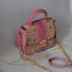 EMILY Genuine python skin top handle bag  Color baby pink with bronze Size: 21/16/11 cm (8.26/6.29/4.33 inches)  Handmade in Bali with lots of love Face: genuine python skin Lining: eco suede  Handmade in Bali  with lots of love   This is a made to order item, usually it takes from 1-2 weeks to ship it depending on tailors capacity and Bali local holdays If you need any adjustments please feel free to message me NOTE:  we use one pattern  but each garment is unique and is slighly different, as i Luxury Snake Print Satchel Bag, Luxury Snake Print Top Handle Bags, Luxury Snake Print Shoulder Bag For Daily Use, Luxury Snake Print Shoulder Bag, Luxury Pink Satchel As Gift, Luxury Pink Satchel As A Gift, Luxury Pink Satchel Gift, Luxury Snake Print Bag For Daily Use, Luxury Rectangular Snake Print Bag