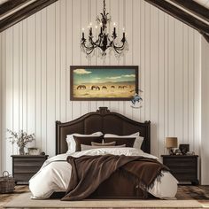 a large bed sitting under a chandelier next to a painting on the wall