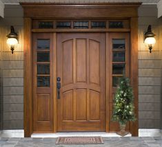 a wooden door with glass panels on the front and side doors to both sides is shown