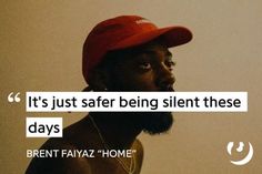 a man wearing a red hat with the words it's just safer being silent these days