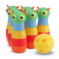 several colorful toy bowling pins and a ball