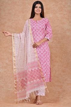 Introducing our Pink and White Cotton Kurti Set, a charming ensemble that is perfect for your picnics and city explorations. This set features delicate floral Block Print patterns all over the Kurti, adding a touch of elegance to your style. Crafted from lightweight material, it ensures your comfort all day long. Complete with a matching white pant and a Kota cotton dupatta. Size fits : XL Colour : Pink,White Kurti/Pant Fabric : Cotton Length Of Kurti : 40 inches Sleeve length : 3/4 Sleeves Back Feminine Cotton Sets With Floral Print, White Block Print Sets For Summer, Pink Block Print Sets For Spring, Spring Pink Block Print Sets, Spring Block Print Pink Sets, Traditional Floral Print Sets For Summer, Traditional Floral Print Summer Sets, Traditional Summer Sets With Floral Print, White Block Print Sets For Spring