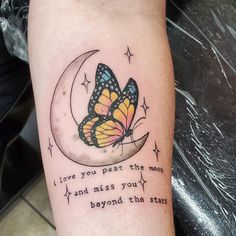 a tattoo with a butterfly on the moon and words below it that says i love you past the moon and miss you beyond the star