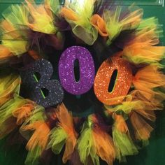 a wreath with the word boo spelled out on it