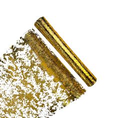 a gold and silver glittered object on a white background