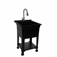 a black sink with a faucet on the side and a metal faucet