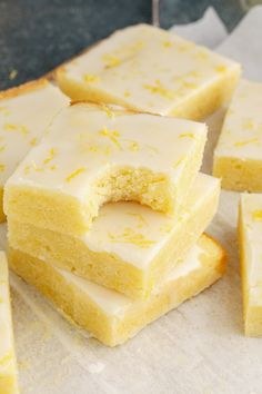 several pieces of cake sitting on top of a piece of parchment paper next to each other