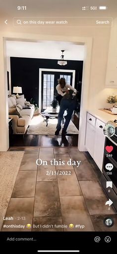 a man is dancing in the middle of a room with tile flooring and white walls