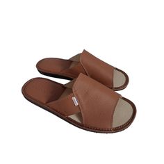 Comfortable, leather house men's slippers by Bosaco in gold-brown color. Their upper is made of high-quality natural leather, which guarantees durability and comfort of wearing. These summer flip flops feature a leather insert on the heel that adds style and durability, while being practical and stylish for all your warm-weather adventures. Mens slippers have a slightly wider cut. The wider shape of the summer slippers makes them perfect for people with wider and tall feet. The rubber sole provi Comfortable Brown Slippers With Leather Sole, Leather Slide Slippers With Cushioned Footbed, Comfortable Brown Closed Toe Slippers, Brown Closed Toe Slippers With Leather Footbed, Comfortable Brown Slippers With Cushioned Footbed, Comfortable Brown Leather Shoes With Leather Footbed, Classic Brown Slides With Leather Lining, Brown Leather Shoes With Leather Footbed, Brown Closed Toe Slippers With Rubber Sole