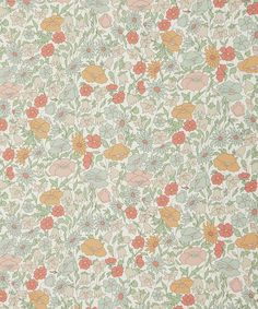 an old wallpaper with many flowers and leaves on the surface, all in different colors