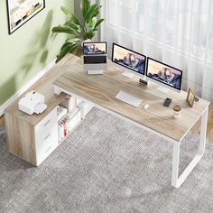 a computer desk with two monitors, keyboard and mouse on it in front of a window