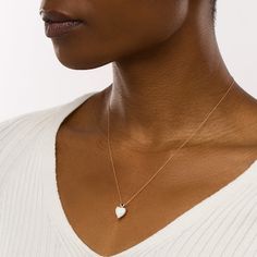 Achieve a casual and cute look with this heart-shaped lab-created opal solitaire and mini puff heart-top pendant in rose gold. Fashioned in precious 10K rose gold This design glistens with a 10.0mm heart-shaped iridescent lab-created opal cabochon. The dainty puffed heart bail completes this sweet style. This pendant suspends along an 18.0-inch rope chain that secures with a spring-ring clasp. Fine Jewelry White Heart Charm Necklace, White Fine Jewelry Heart Necklace With Charm, White Heart Charm Necklace In Fine Jewelry Style, Minimalist White Heart Cut Jewelry, Minimalist White Heart-cut Jewelry, Rose Gold Plated Heart Shaped Necklace, Elegant Rose Gold Tarnish-resistant Heart Necklace, Rose Gold Polished Heart Pendant Jewelry, Opal Heart Pendant Necklace For Gift