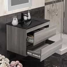 a bathroom vanity with drawers and a sink