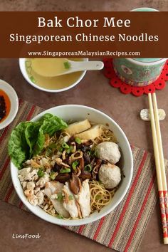 a bowl filled with meat and vegetables next to chopsticks on top of a table