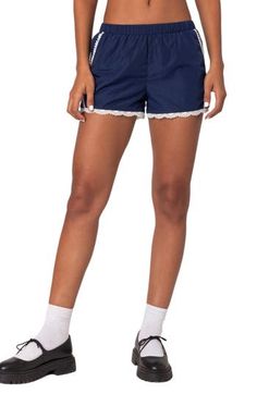 A lace trim and leggy length keep comfort on lock in these track shorts topped with a comfortable elastic waist. Elastic waist 100% polyester Machine wash, dry flat Imported Nylon Loungewear Shorts, Casual Stretch Bottoms With Lace Trim, Casual Cotton Shorts With Lace Trim, Stretch Lace Trim Pajama Shorts, Stretch Lace Trim Shorts, Stretch Shorts With Lace Trim, Casual Shorts With Lace Trim, Casual Pajama Shorts With Lace Trim, Casual Bottoms With Crochet Trim In Short Length