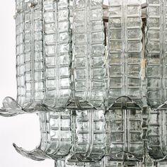 several glass vases stacked on top of each other