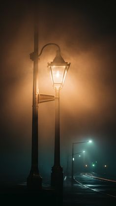 a street light on a foggy night