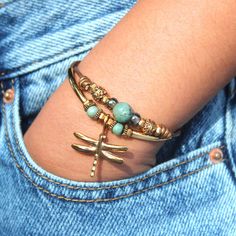 The Gold Plated Dragonfly charm can be placed on most of our bracelets & anklets. We add to your favorite Lizzy James jewelry piece and shine on! The dimensions are 20 mm x 18 mm- 24k gold plate. Since it has a bale it is strung directly on the bracelet of your choice and cannot be removed. Looks amazing on Moss Gold & Leather bracelet. Dragonfly Charm, Gold Leather, Artisan Jewelry, Anklets, Jewelry Pieces, Leather Bracelet, Gold Plate, Plating, Leather