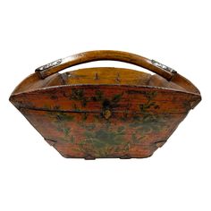 an old wooden basket with floral designs on it