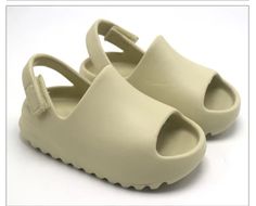 Toddler slides Velcro strap Unisex style Beige Slides For Summer Outdoor, Casual Slides With Adjustable Straps For Spring, Casual Cream Slides, Trendy Outdoor Slides For Spring, Casual Cream Slides For Spring, Casual Slides With Adjustable Strap, Solid Color Open Toe Slides For Outdoor, Open Toe Slides For Outdoor, Modern Adjustable Slides For Spring