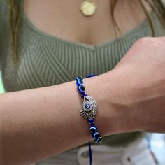 The Evil Eye charm has been used for centuries as a talisman for protection against misfortune and malicious intent. It is thought to bring the wearer good luck.This adjustable sliding knot bracelet comes in an assortment of evil eye styles in a silver finish. Adjustable Spiritual Braided Bracelet With Evil Eye, Adjustable Spiritual Evil Eye Braided Bracelet, Adjustable Braided Evil Eye Bracelet For Spiritual Protection, Adjustable Evil Eye Spiritual Jewelry, Adjustable Spiritual Evil Eye Jewelry, Spiritual Jewelry With Sliding Knot For Festivals, Symbolic Friendship Bracelets, Adjustable Silver Evil Eye Friendship Bracelets, Adjustable Evil Eye Beaded Bracelets For Good Luck