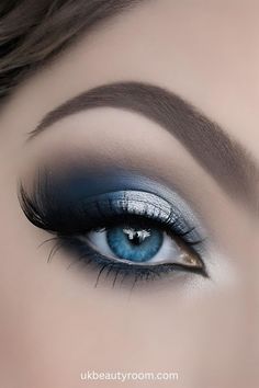 Smokey eye makeup can help to enhances blue eyes by making them stand out, and appear more vibrant. It also adds depth and allure. This post contains a list of smokey eye makeup looks for blue eyes. soft, natural, bridal, light, brown, step by step, dark, tutorial, wedding, navy, ideas for Blue Eyeshadow With Brown Eyes, Blue Makeup Blue Eyes, Prom Makeup For Blue Eyes Brown Hair, Navy And Silver Makeup, Eye Makeup Dark Blue, Blue Eyes Eyeshadow Looks, Eye Makeup For Navy Blue Dress, Makeup For Blue Outfit, Smokey Eye Makeup Blue