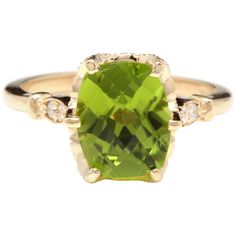 an oval cut peridot and diamond ring