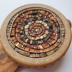 a wooden box with a mosaic design on it