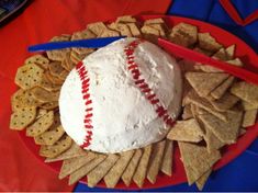 a plate with crackers and a baseball on it