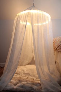 a bed with a white canopy over it