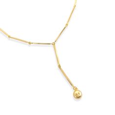 Gold Bar Chain Lariat Necklace Enhance your look with a touch of sophistication and luxury with this necklace. Crafted with 18k gold and featuring an exquisite bar chain lariat with a dangling sphere, this necklace is sure to elevate any outfit with its classic elegance. Material: 18k gold plated, triple plated, cubic zirconiaSize: Approx. 1⁄16" thick, 8mm sphere, 2" dropLength: Approx. 18", plus a 2" extensionClosure: Lobster clasp T Bar Necklace, Gold Bar, Lariat Necklace, Bar Necklace, Classic Elegance, Lobster Clasp, 18k Gold, Gold Plate, Plating