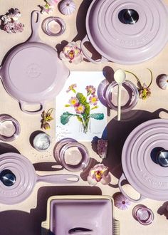 purple dishes and utensils laid out on a table