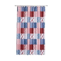 a red, white and blue checkered curtain hanging on a rodo - end