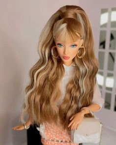 a doll with long blonde hair and blue eyes holding a white purse in her hand