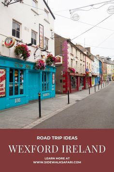 the road is lined with shops and buildings