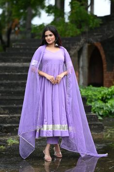 PRODUCT DESCRIPTION :-Shine bright like sunshine!Anarkali :- Pure cottonPant :- CottonDupatta :- Organza silkClosure Used:- Side zipColor:- Lilac purpleCare Instructions :- Dry clean onlyModel Size :- Model is wearing XS sizeModel Height :- 5.5DISCLAIMER :- Slight color variations may occur due to different screen resolution. Purple Churidar With Gota Work, Traditional Drape Purple Salwar Kameez With Gota Work, Traditional Purple Gota Work Salwar Kameez, Purple Anarkali Style Sharara With Cutdana, Semi-stitched Purple Kurta With Gota Work, Purple Straight Kurta With Sheer Dupatta, Purple Straight Kurta Anarkali Set For Wedding, Floor-length Purple Chanderi Sharara, Purple Floor-length Chanderi Sharara